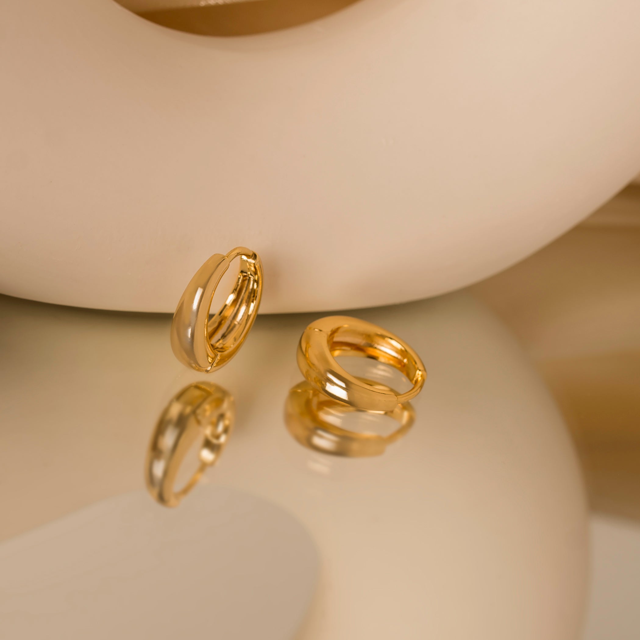 dome gold huggie hoop earrings