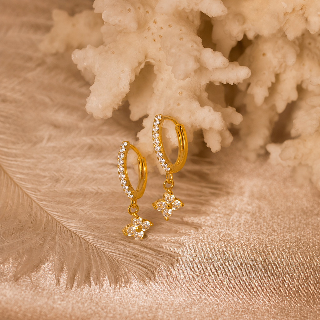Gold hoop earrings with cz clover drops