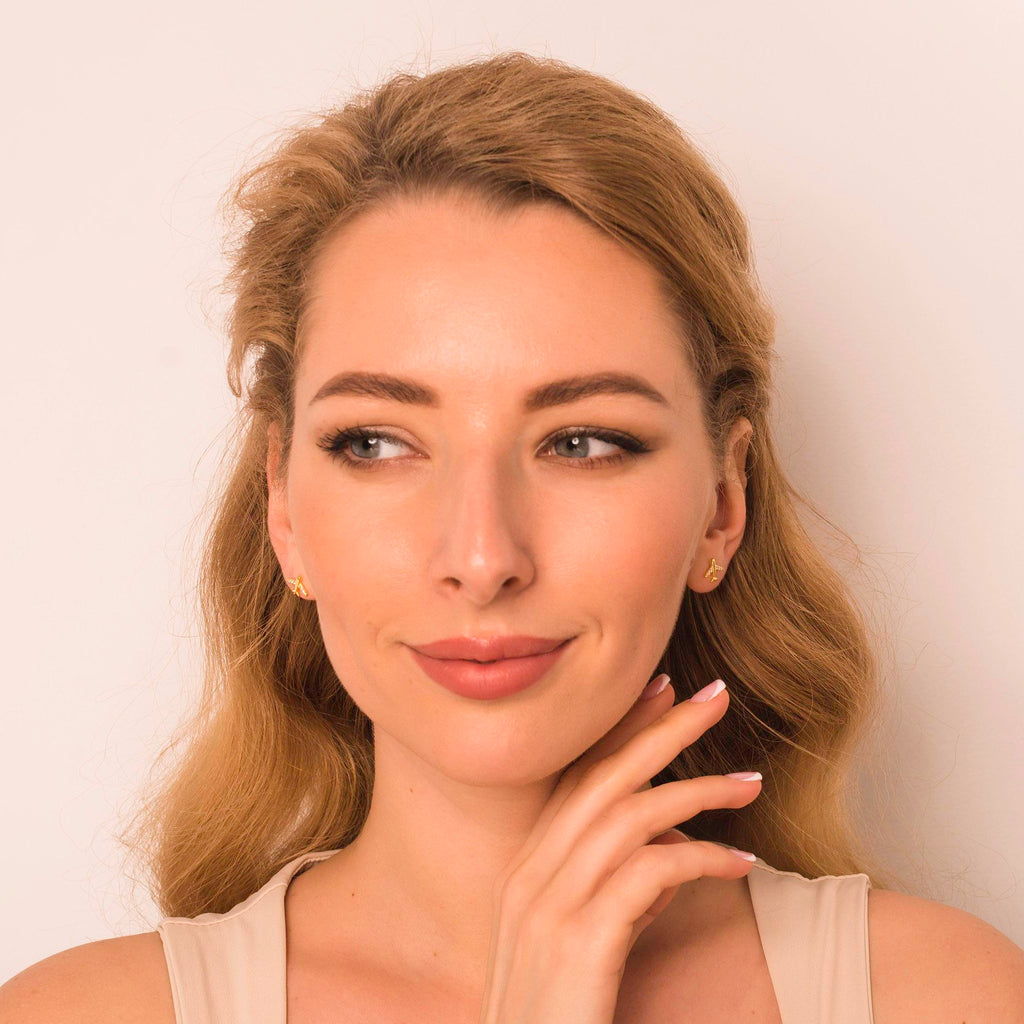 gold plane earrings