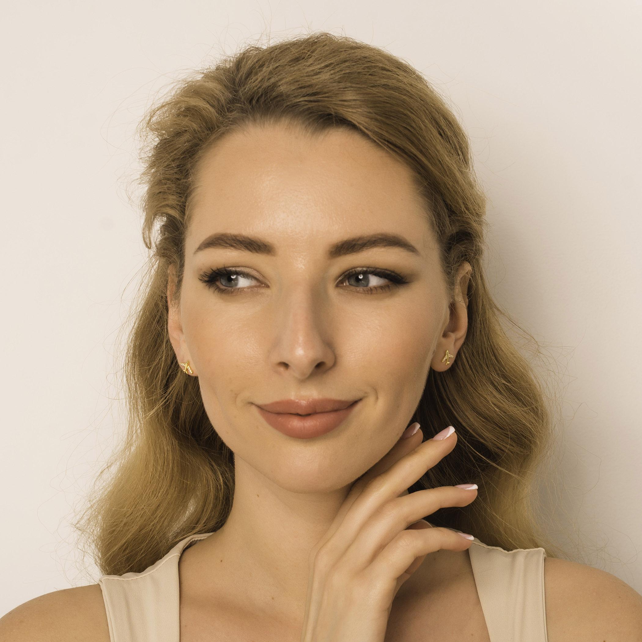 gold plane earrings