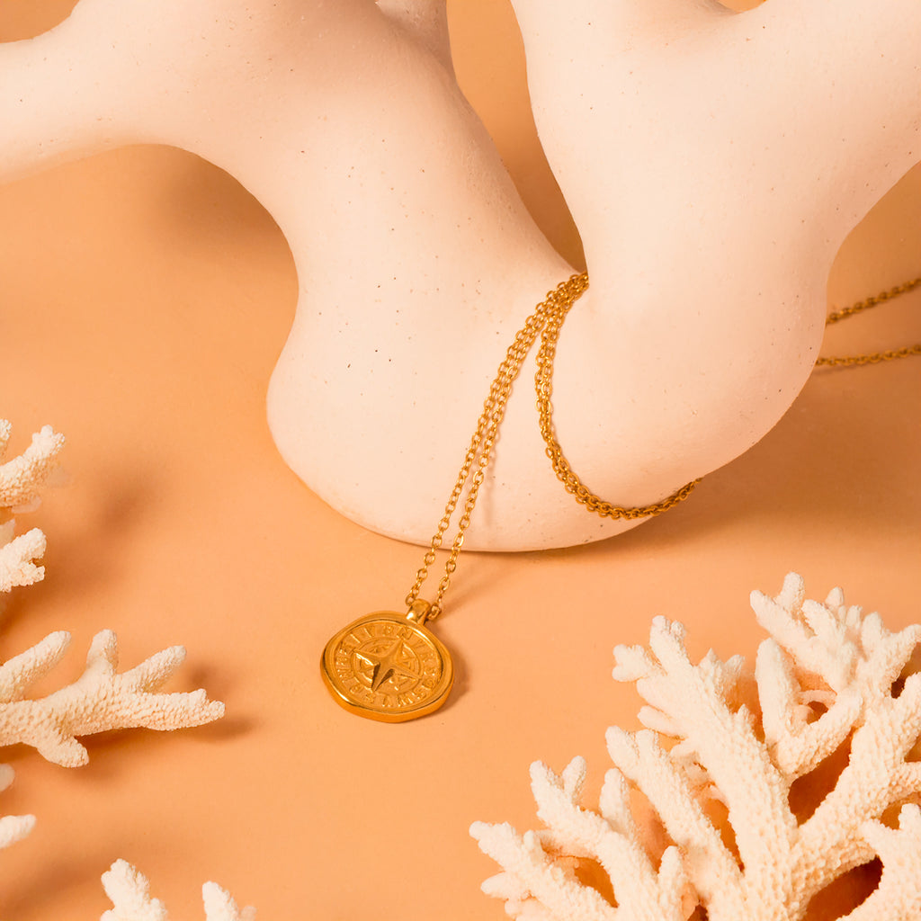 gold compass necklace