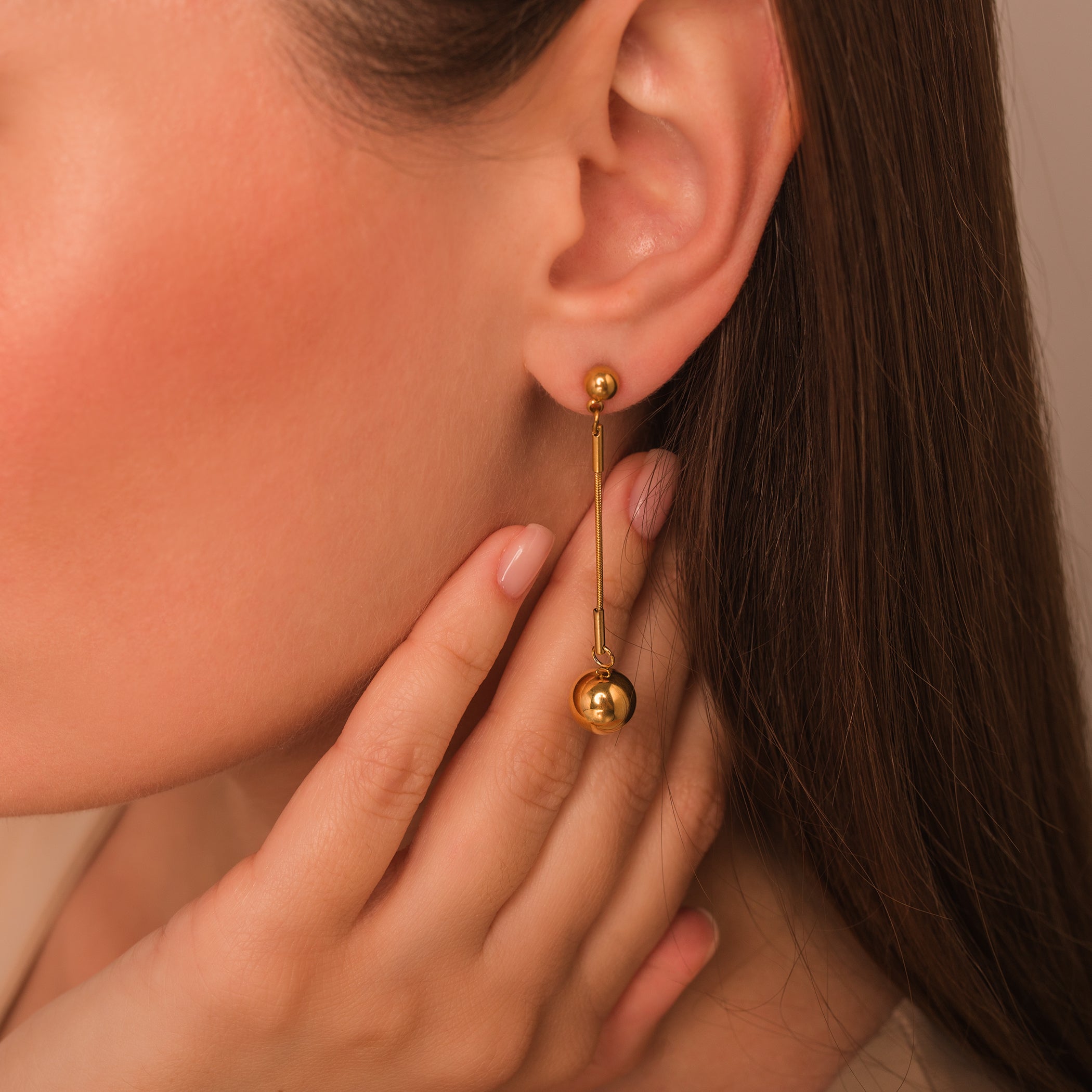 gold dangle ball earrings