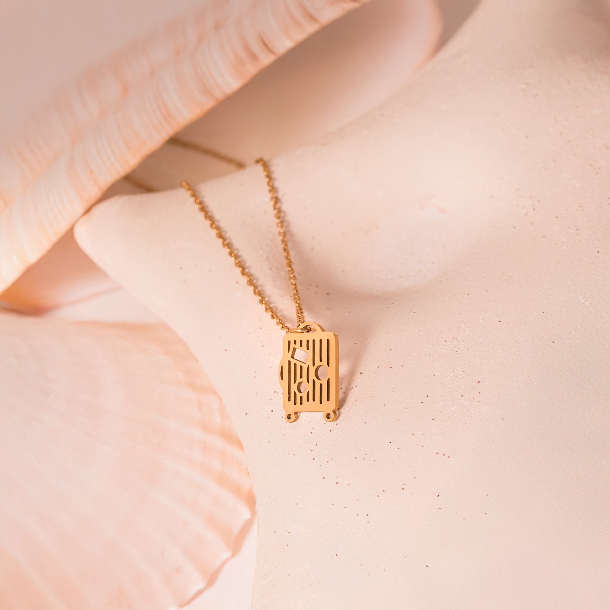 gold luggage necklace