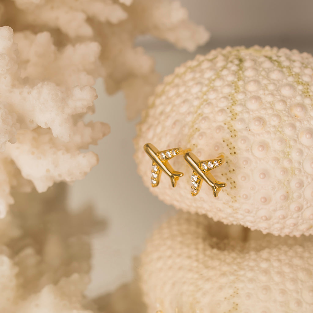 gold plane stud earrings