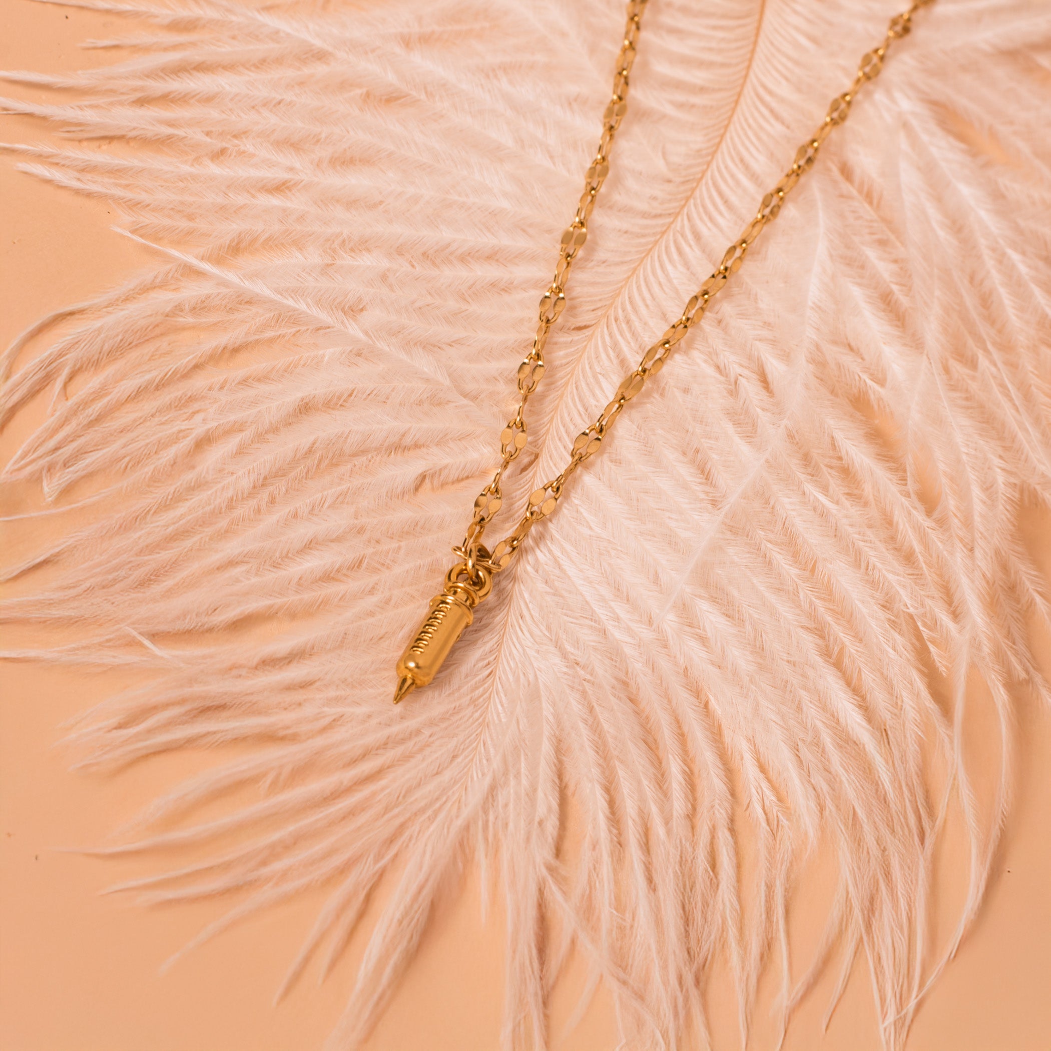 gold syringe necklace