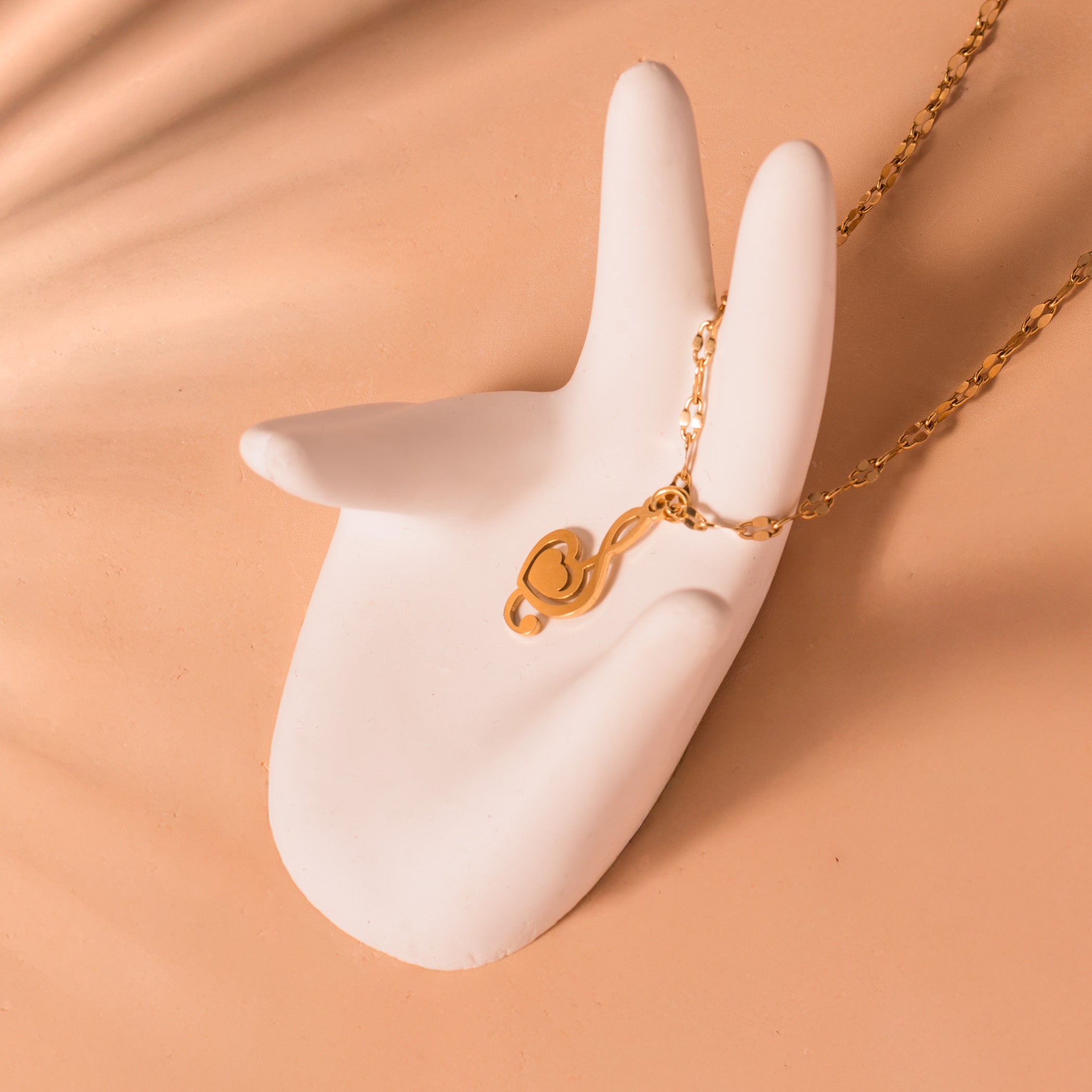 gold treble clef necklace