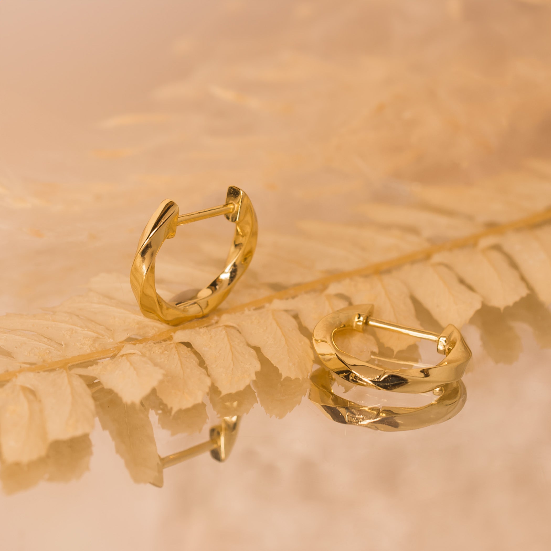 gold twisted hoop earrings