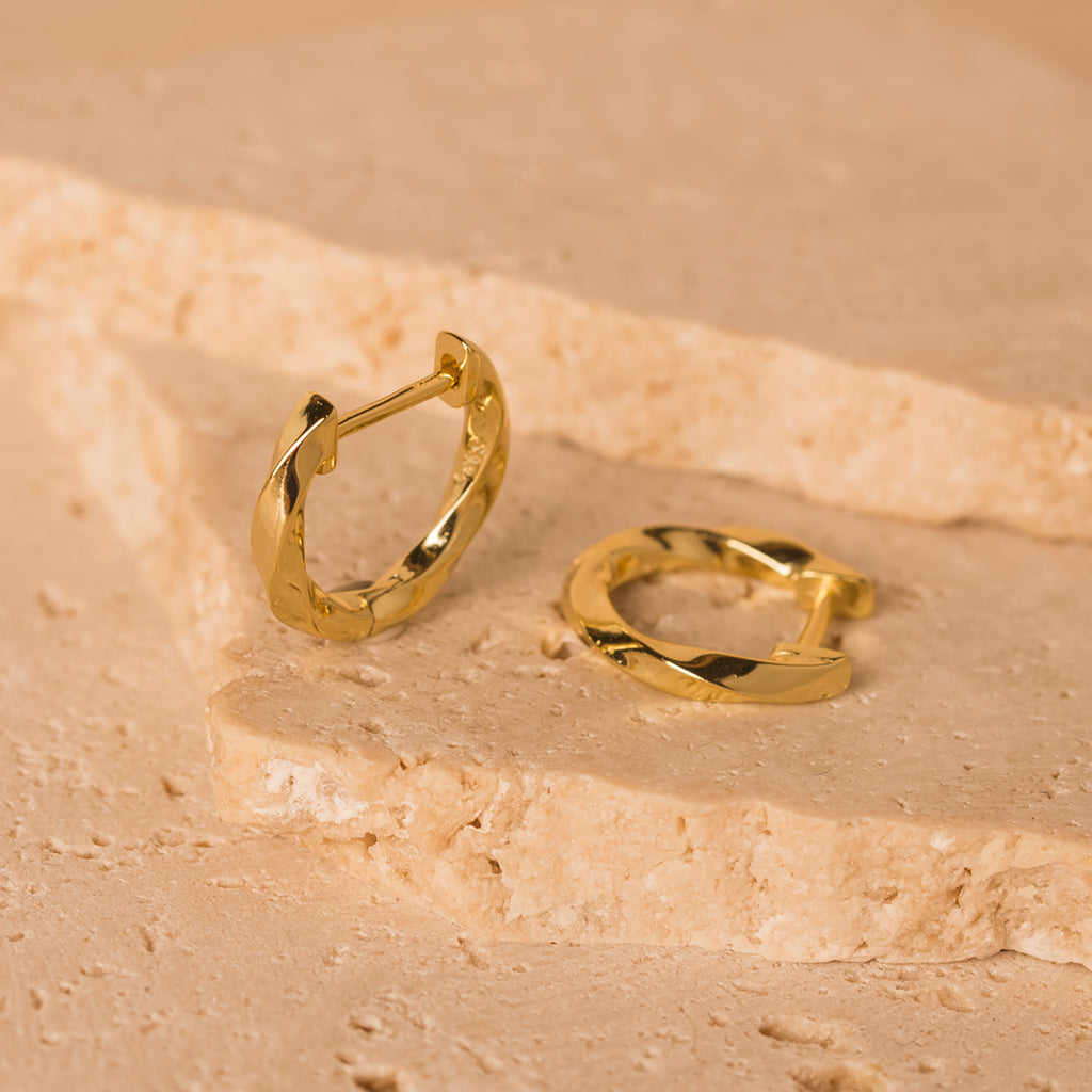 gold twisted huggie hoops