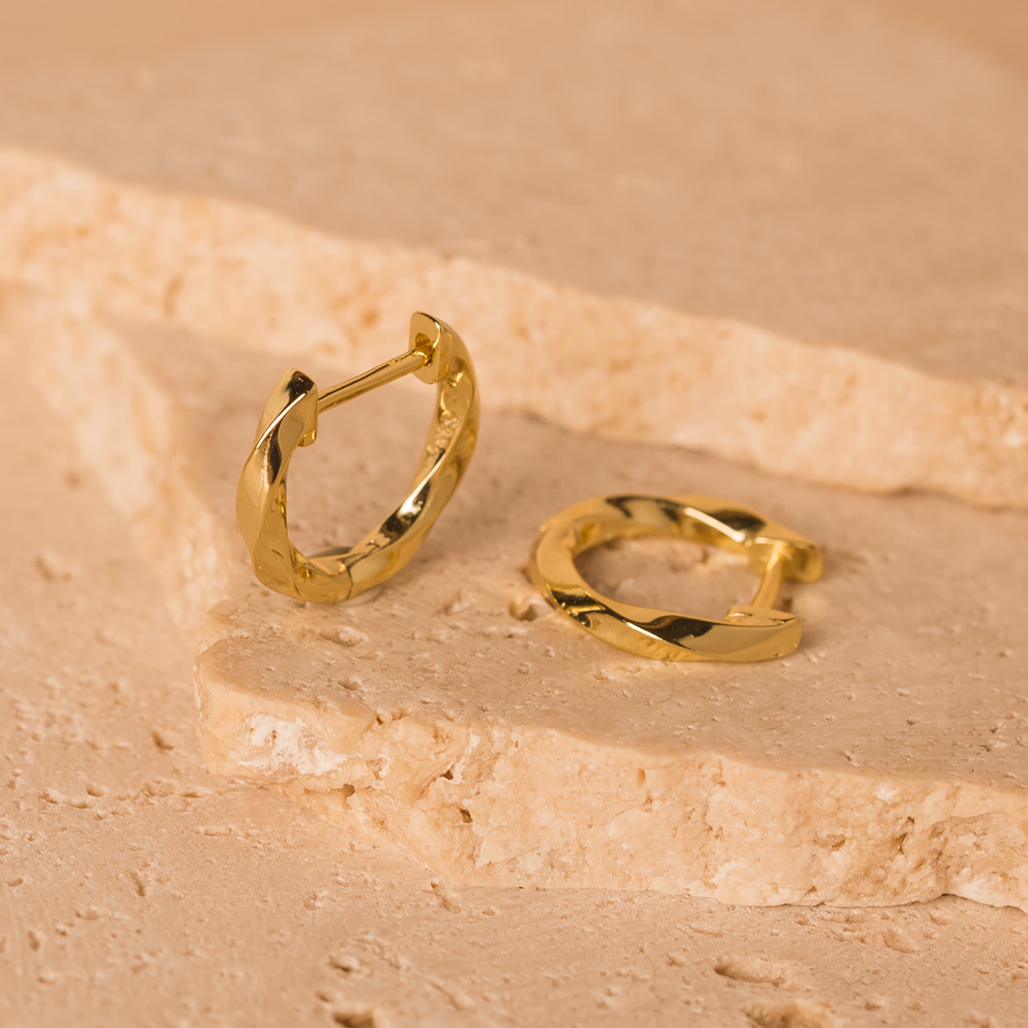 gold twisted huggie hoops