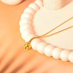 gold world heart necklace
