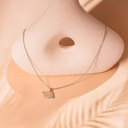 silver Saturn charm necklace
