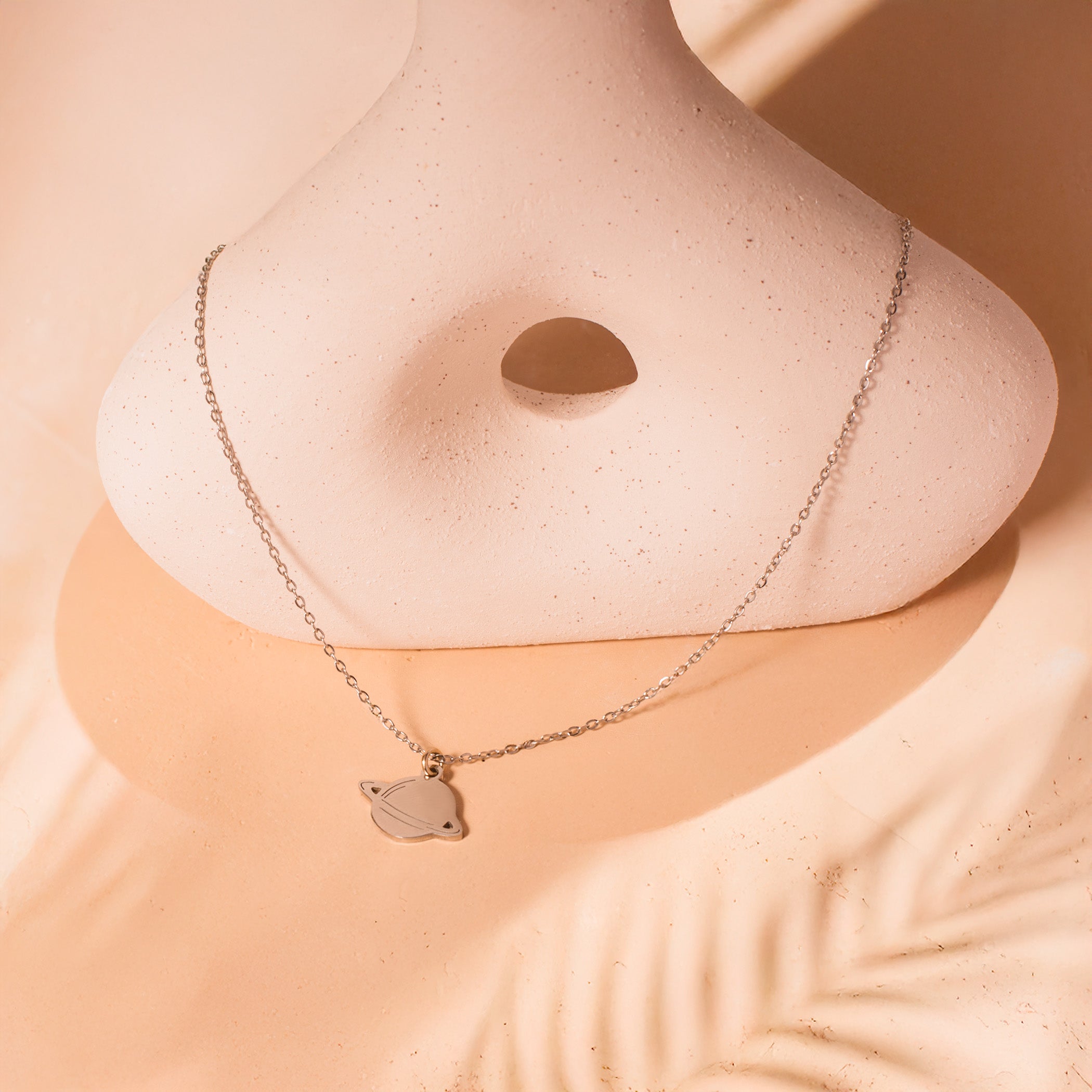 silver Saturn charm necklace