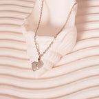 silver baby feet necklace
