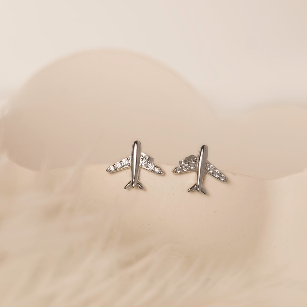 silver plane stud earrings