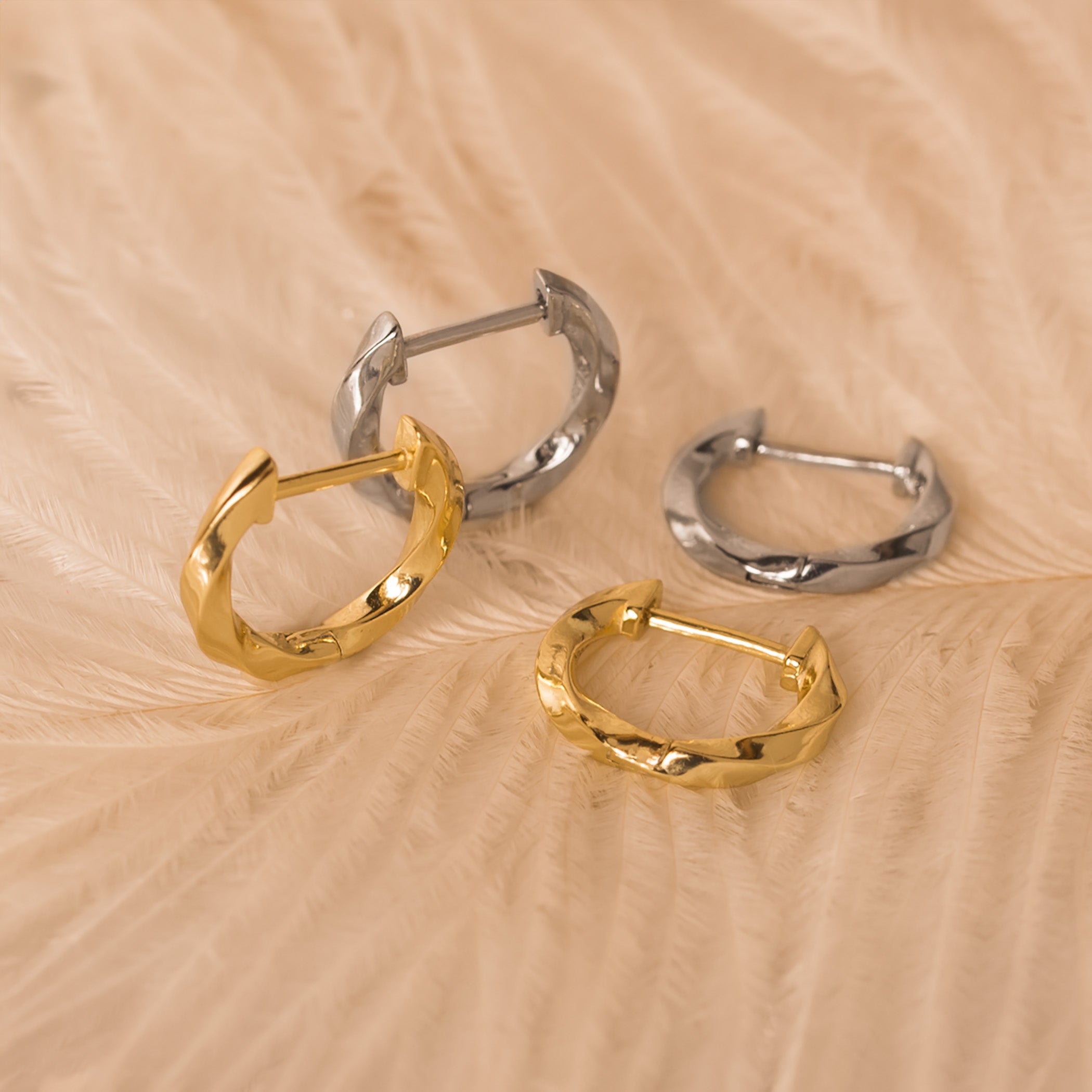 twisted gold silver hoop earrings